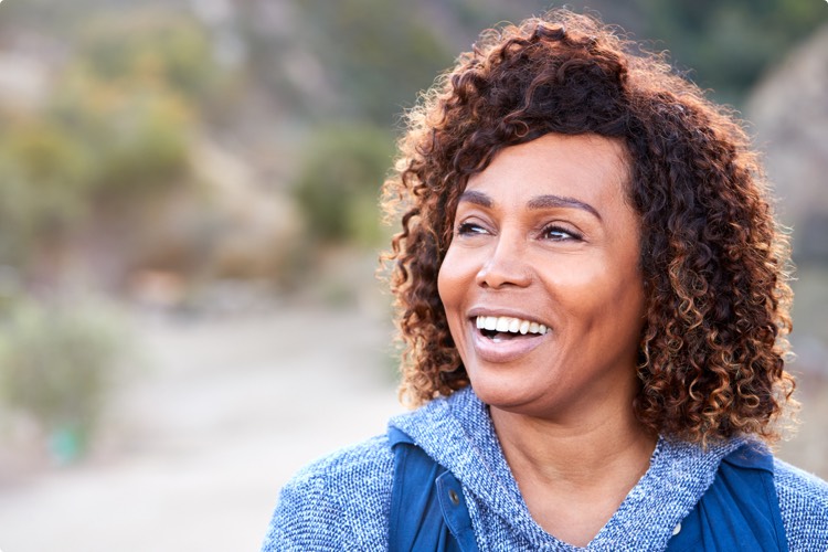 A person smiling outdoors