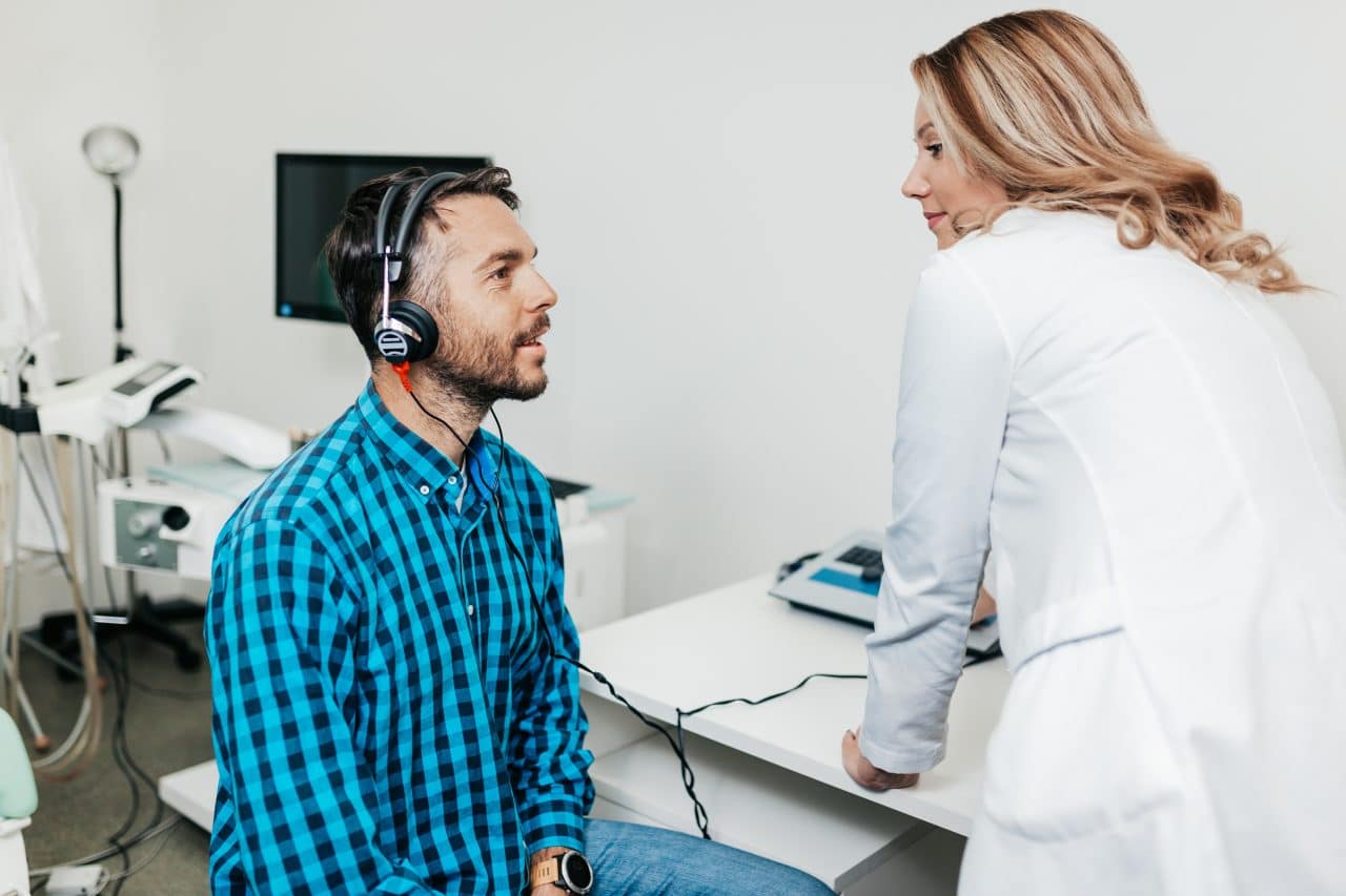 Man gets a hearing test.